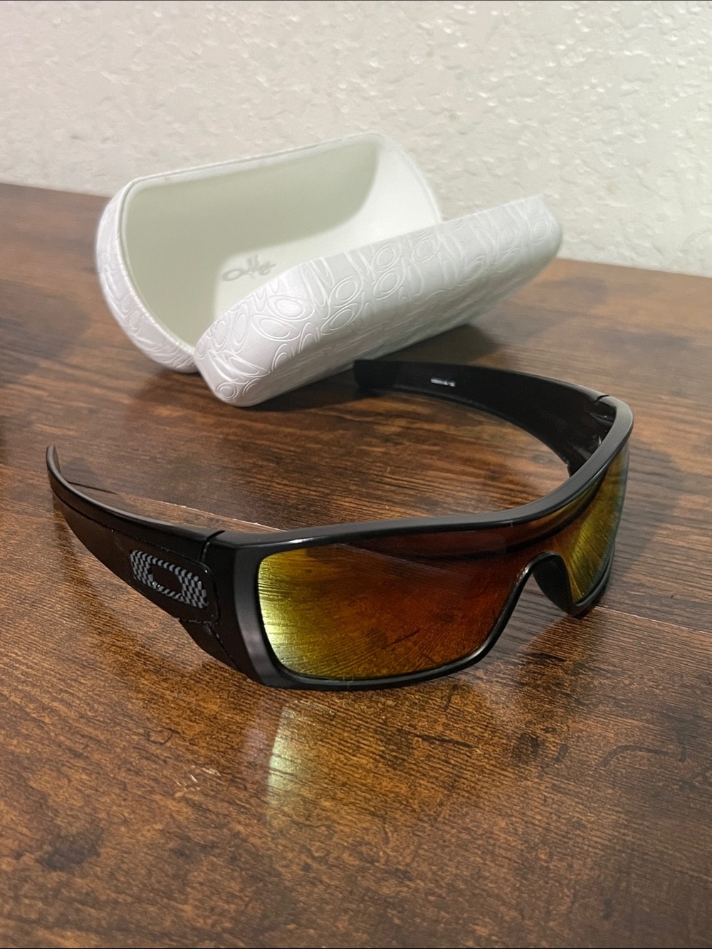 Oakley Black Frame Sunglasses with Amber Mirrored Lenses